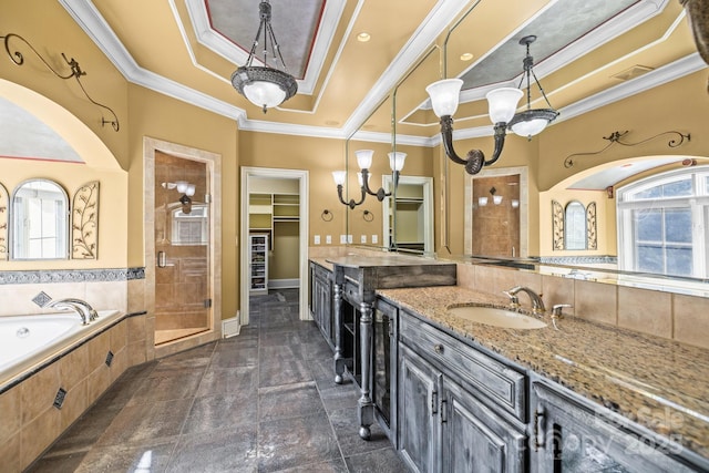 full bath with crown molding, a tray ceiling, a healthy amount of sunlight, and a sink