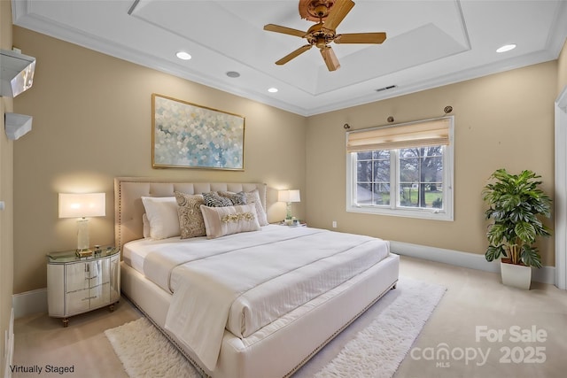 bedroom featuring a tray ceiling, light colored carpet, visible vents, and recessed lighting