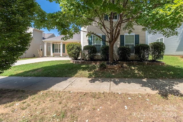 view of front of property with a front lawn