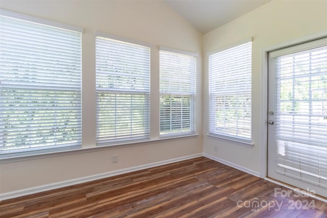 unfurnished sunroom with lofted ceiling and a healthy amount of sunlight