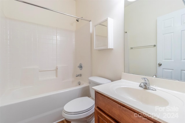 full bathroom featuring shower / bathing tub combination, vanity, and toilet