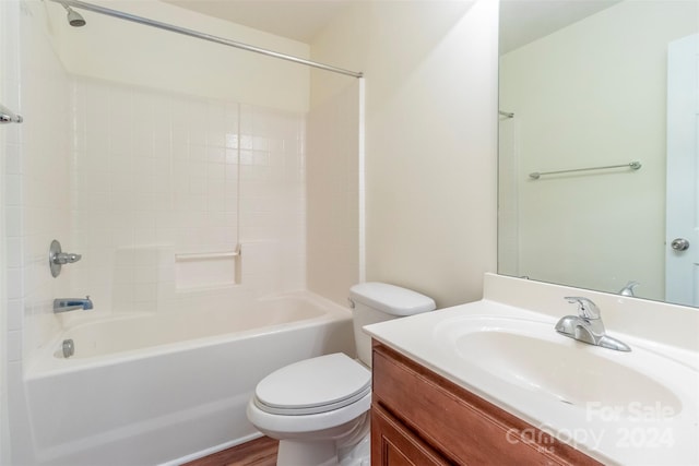 full bathroom featuring vanity, hardwood / wood-style floors, toilet, and shower / washtub combination