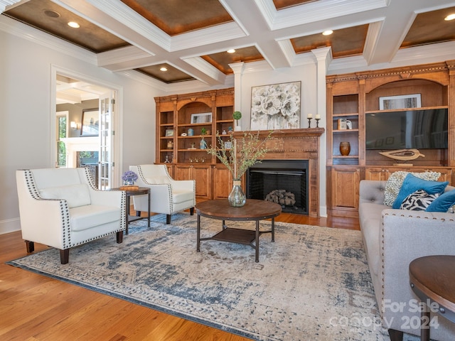 living room featuring crown molding, hardwood / wood-style floors, beamed ceiling, and coffered ceiling