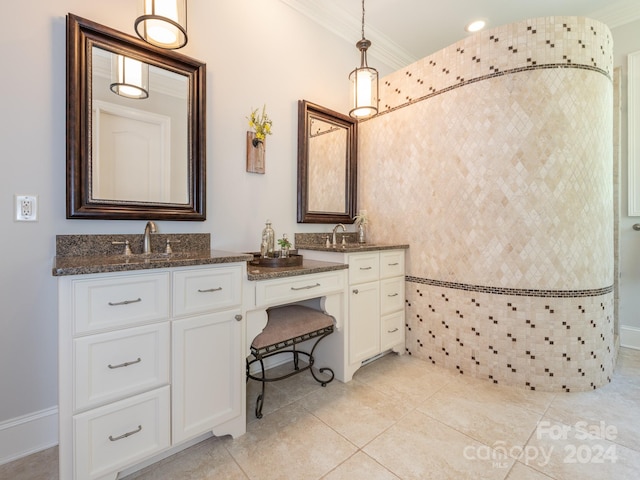 bathroom featuring vanity, ornamental molding, and tile patterned floors