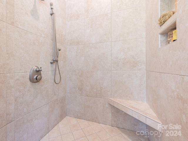 bathroom with tiled shower