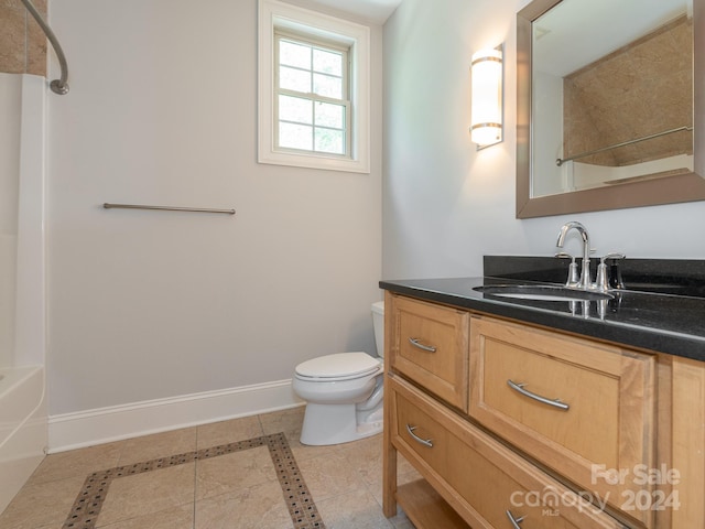 full bathroom featuring vanity, tub / shower combination, toilet, and tile patterned floors