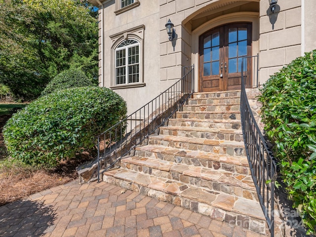 entrance to property featuring french doors