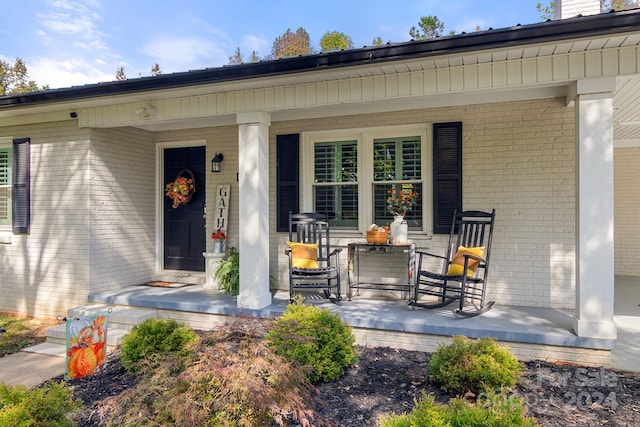 entrance to property with a porch