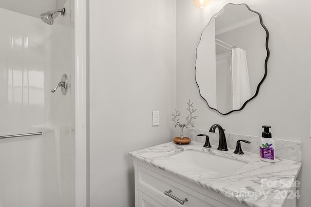 bathroom with vanity and a shower with shower curtain