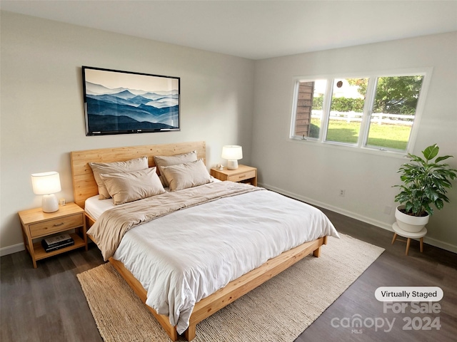 bedroom featuring dark wood-type flooring