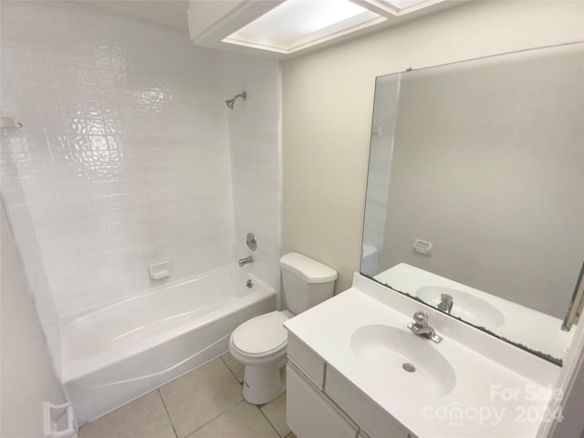 full bathroom featuring vanity, toilet, tile patterned flooring, and tiled shower / bath