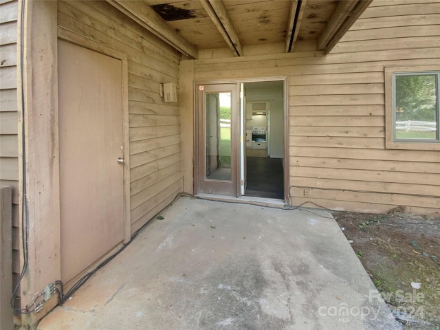 doorway to property featuring a patio