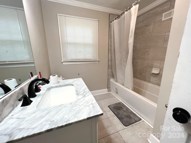 bathroom featuring shower / tub combo, a textured ceiling, vanity, crown molding, and tile patterned flooring