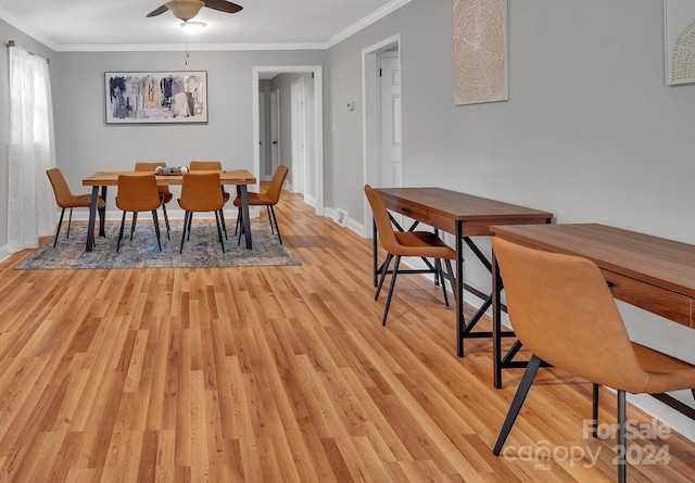 dining area with ceiling fan, ornamental molding, and light hardwood / wood-style flooring