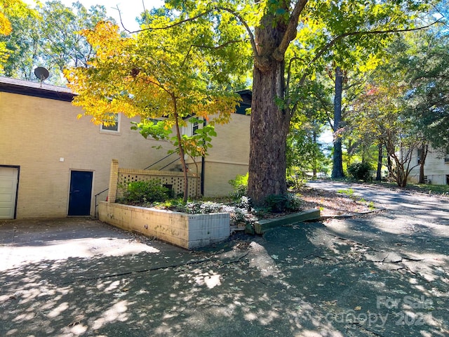 view of side of property featuring a garage