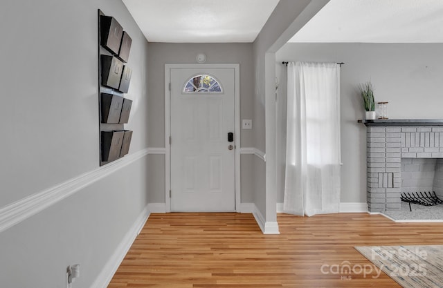 508 Deese St, Monroe, NC 28112 - entrance foyer with a fireplace and light wood finished floors
