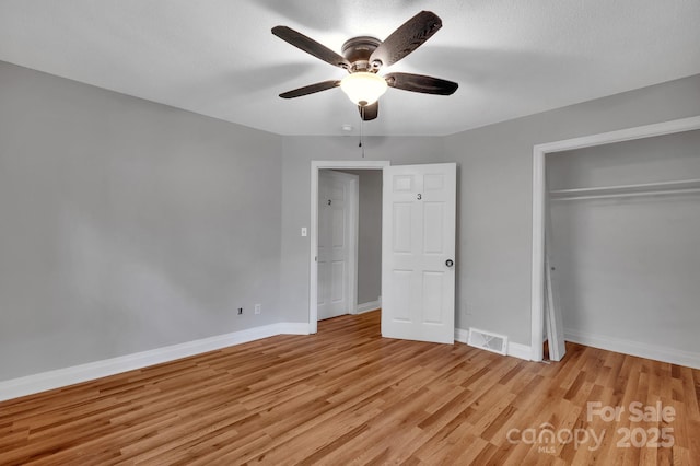 508 Deese St, Monroe, NC 28112 - unfurnished bedroom featuring light wood-style floors, a closet, and a ceiling fan