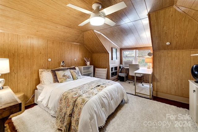 carpeted bedroom with wood ceiling, lofted ceiling, wooden walls, and ceiling fan