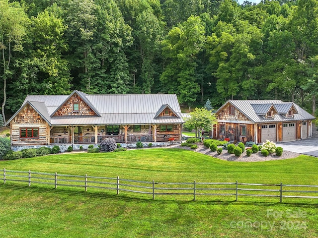 view of front of property featuring a front yard and a rural view