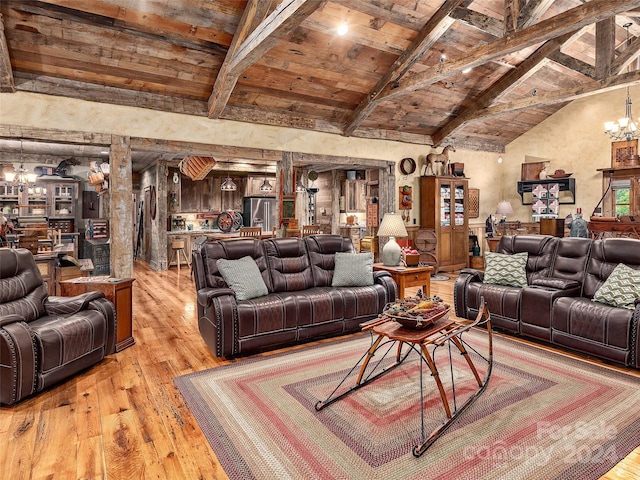 living room featuring a notable chandelier, light hardwood / wood-style floors, lofted ceiling with beams, and wooden ceiling