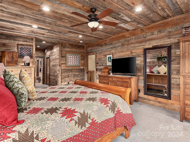 carpeted bedroom featuring wooden walls, wood ceiling, and ceiling fan