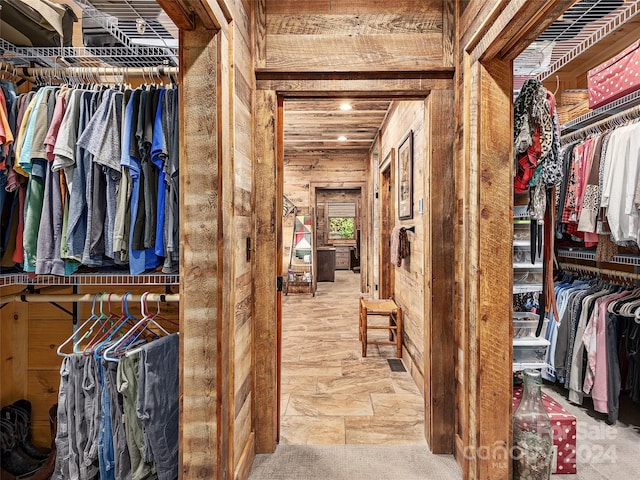 spacious closet featuring carpet flooring