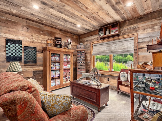 living area featuring light carpet, wood walls, and wood ceiling