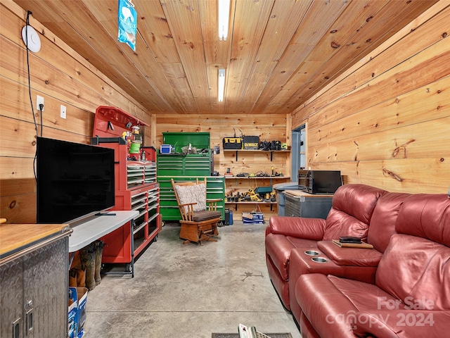 living room with concrete floors, wood walls, and wood ceiling