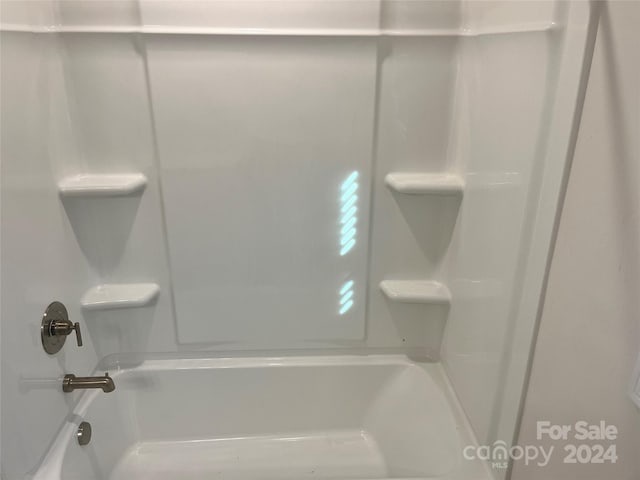 bathroom with shower / tub combination