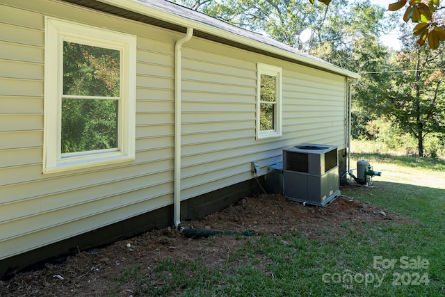 view of home's exterior with central air condition unit