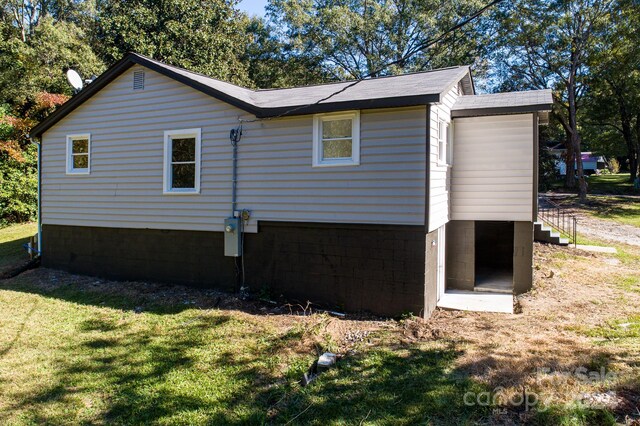 view of home's exterior featuring a lawn