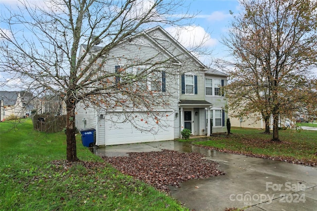 front of property with a garage and a front yard