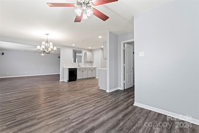 unfurnished living room with ceiling fan with notable chandelier, dark hardwood / wood-style flooring, and sink