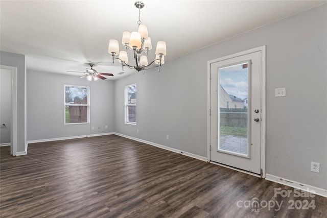 interior space featuring dark hardwood / wood-style floors and ceiling fan with notable chandelier