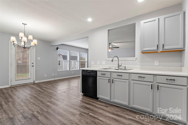 kitchen with black dishwasher, dark hardwood / wood-style flooring, sink, and a wealth of natural light