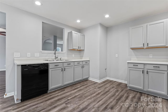 kitchen with dishwasher, gray cabinets, dark wood-type flooring, and sink