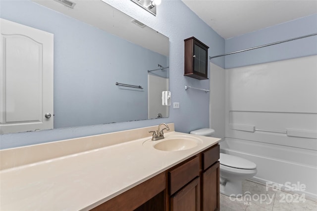 full bathroom with tile patterned floors, vanity, toilet, and washtub / shower combination