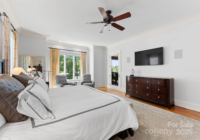 bedroom with ceiling fan, access to outside, ornamental molding, and light hardwood / wood-style flooring