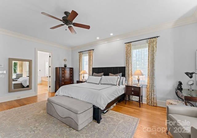 bedroom with ceiling fan, light hardwood / wood-style floors, and multiple windows