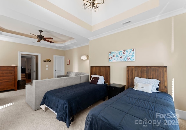 bedroom featuring ceiling fan with notable chandelier, a raised ceiling, light colored carpet, and crown molding