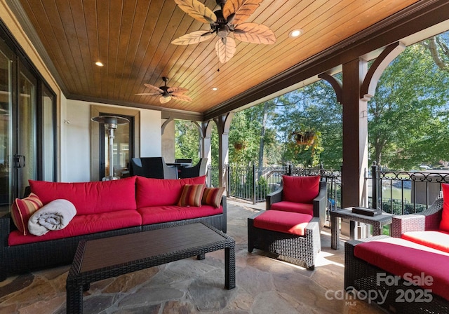 view of patio featuring ceiling fan, an outdoor hangout area, and a balcony