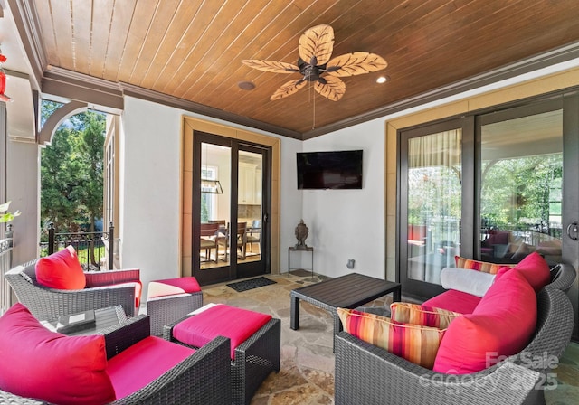 view of patio / terrace with ceiling fan, french doors, and an outdoor living space