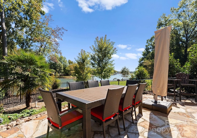 view of patio featuring a water view