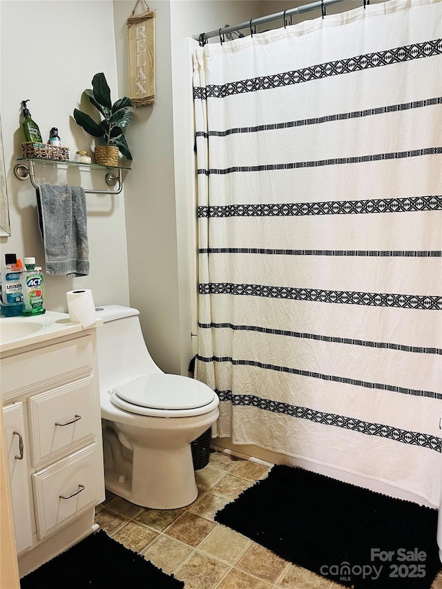 bathroom with vanity and toilet