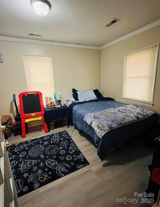 bedroom featuring crown molding