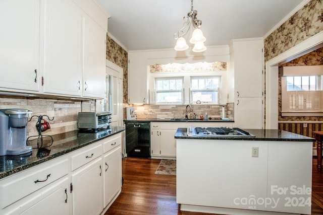 kitchen with a kitchen island, black dishwasher, dark wood-type flooring, dark stone countertops, and white cabinetry