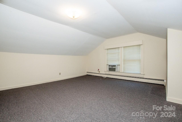 additional living space featuring cooling unit, lofted ceiling, a baseboard heating unit, and carpet