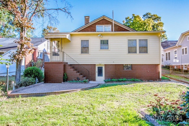 view of front of home with a front yard