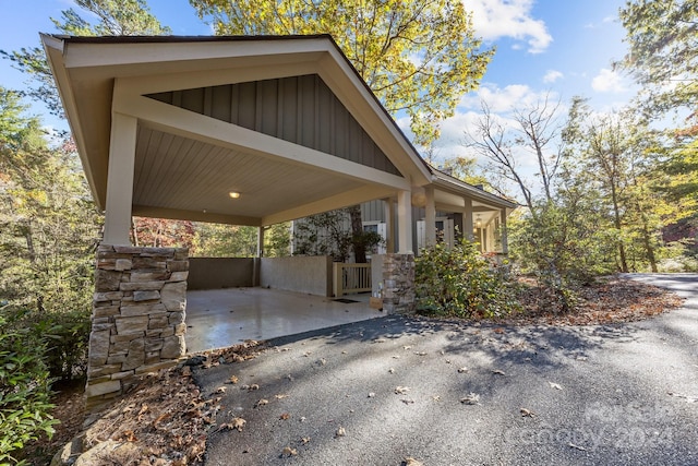 view of side of property with a carport