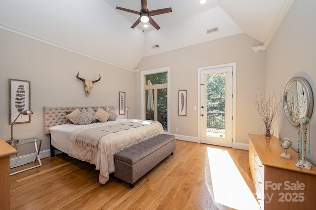 bedroom with light wood-type flooring, access to exterior, visible vents, and vaulted ceiling